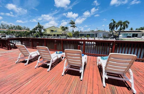 Coral Ridge Isles House | Fort Lauderdale 4/2 with screened-in pool and dock.