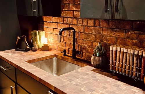 Seaport District Apartment | Fort Point Corner of Windows brick & beam loft