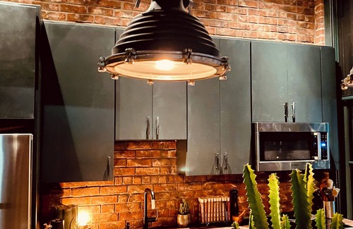 Seaport District Apartment | Fort Point Corner of Windows brick & beam loft