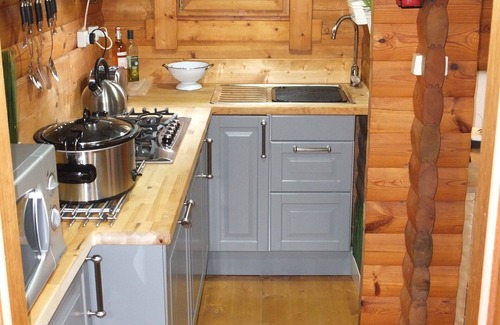 Saint-Germain-de-Tallevende-la-Lande-Vaumont Ski Chalet | Traditional Log Cabin on quiet Residential Commune overlooking Lake Dathee
