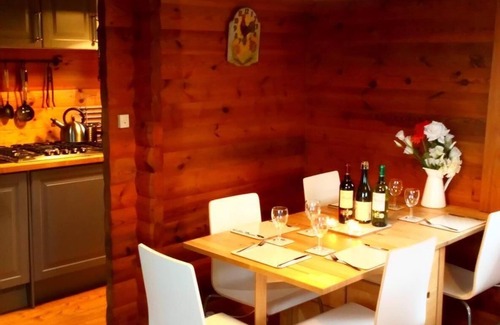 Saint-Germain-de-Tallevende-la-Lande-Vaumont Ski Chalet | Traditional Log Cabin on quiet Residential Commune overlooking Lake Dathee