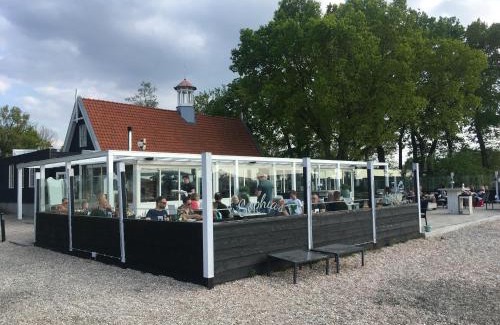 Hulshorst House | Fraai Tiny House aan het veluwemeer met uitzicht & veranda
