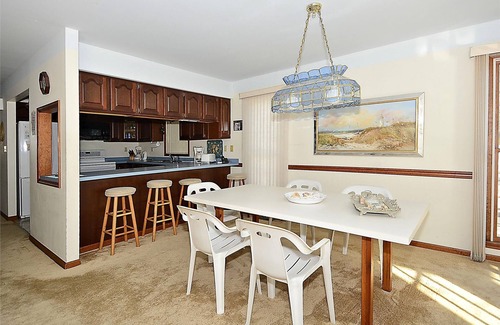 Sandpiper Pines House | FREE DAILY ACTIVITIES! Lovely 4 bedroom + Den, (Two Master Bedrooms) 3.5 bath home, located on the canal, with boat dock, 2 car garage,just a short walk to the lifequarded beach.