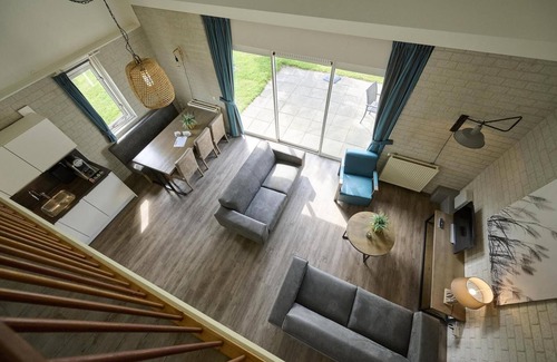 Elburg Cabin | Freestanding bungalows with a view of the Veluwemeer or adjacent to a courtyard garden.