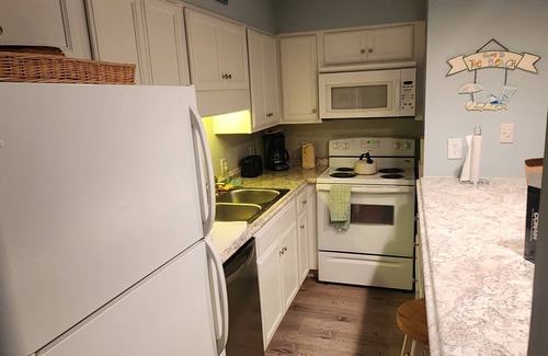 Thomas Drive Condo | Freshly updated beachfront condo with stunning views. Sleeps 4. Onsite Pool.