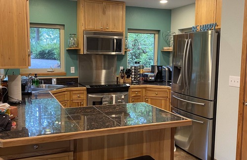 Burley House | Fully equipped house nestled in old growth trees with miles of beaches/trails