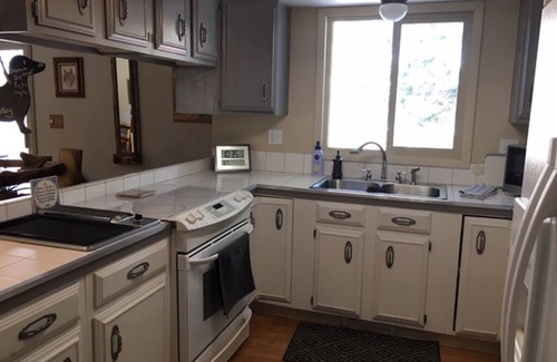 Woodland Park Bed & Breakfast | Furnished Bedroom in our Home with Queen bed - Shared Bath