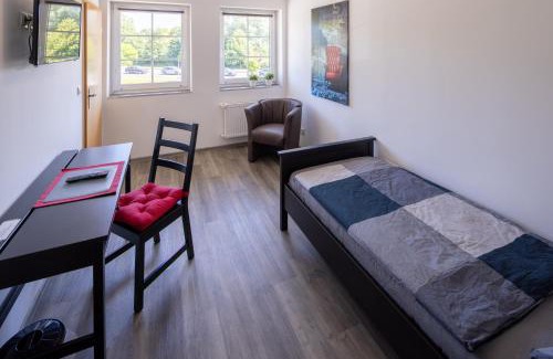 Schortens Apartment | Gästehaus Olympia Wilhelmshaven - Moderne Einzelzimmer mit eigenem Bad für Monteure