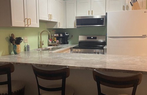 Emerald Isle Condo | Gated community with Indoor and Outdoor Pools.Walk to dining and fun!