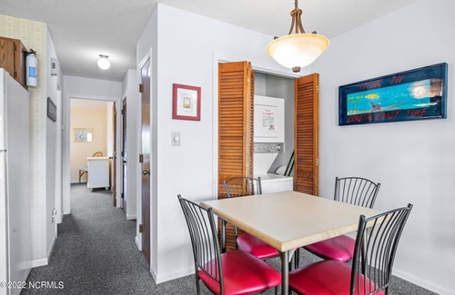 Emerald Isle Condo | Gated community with Indoor and Outdoor Pools.Walk to dining and fun!