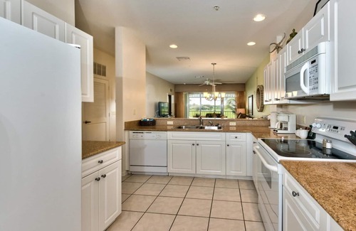 Naples Condo | Genoa Vacation Rental: Stylish 2-BR Condo with Golf & Lake Views. Resort-Style Pool, Hot Tub, and Easy Access to Championship Golf. Minutes from Naples Beaches, 5th Avenue S, and Marco Island