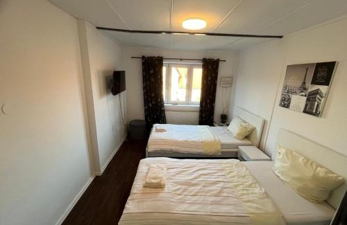 Kiel Apartment | Geräumige 2-Zimmer Monteurunterkunft mit Garten und überdachter Terrasse