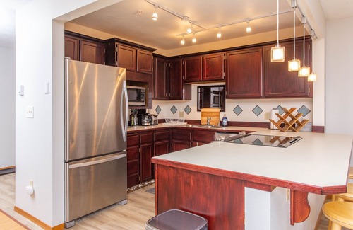 Alyeska Condo | Girdwood condo w/wood-burning fireplace & balcony w/mtn views - walk to lifts
