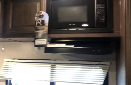 Lafayette House | Glamp in a cozy RV waking up to Nature Trails out your front door.