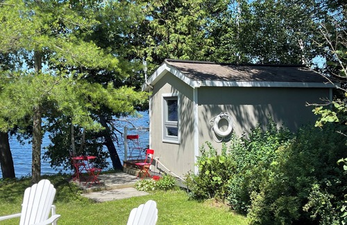 Rideau Lakes Cottage | Glamping anyone? Enjoy picturesque sunsets from your own water’s edge deck!
