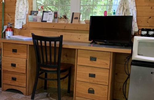 Ashford Cabin | Glamping at its finest in an adorable tiny home cabin that sleeps up to three! Shared hot tub. Beautiful property surrounding the cabin. Short stroll to Copper Creek. Walking distance to Copper Creek Restaurant. 2 miles to Mt Rainier National Park.