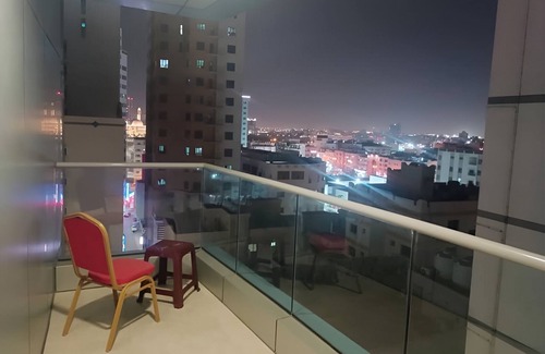 Al Hoora Apartment | Golden Oasis, a luxurious apartment with stunning partial sea & city views.