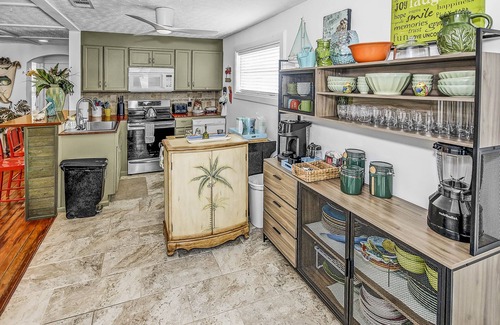 Sunnyside House | Golf Cart INCLUDED, Tiki Bar, Dog-Friendly West End Home 5 Min Ride 2 Beach!