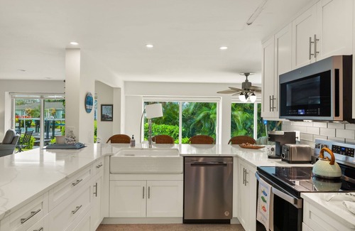 Shell Harbor House | Gorgeous canal front home walking distance to the beach!