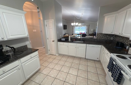Beachwalk Isles House | Gorgeous lake view sunsets with heated, enclosed pool. Close to beaches and golf
