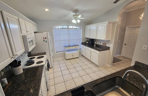 Beachwalk Isles House | Gorgeous lake view sunsets with heated, enclosed pool. Close to beaches and golf