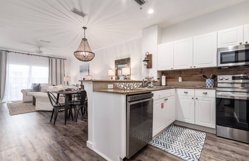 Frangista Beach Condo | Gorgeous renovated condo - Steps from the Beach! Heated Pool! Hot tub!