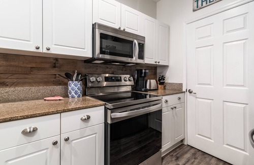 Frangista Beach Condo | Gorgeous renovated condo - Steps from the Beach! Heated Pool! Hot tub!