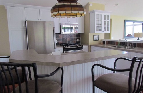 Grand Haven House | Grand River Retreat with Boat Dock