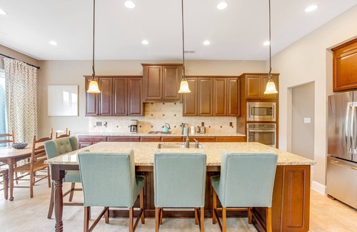 The Glade House | Grande at Canal Pointe home with patio, grill, fireplace, outdoor pool & tennis