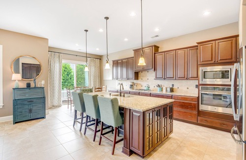 The Glade House | Grande at Canal Pointe home with patio, grill, fireplace, outdoor pool & tennis
