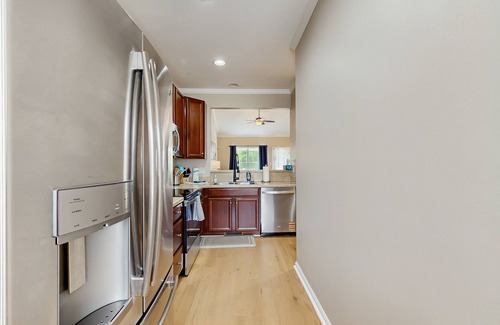 Rehoboth Beach House | Grande at Canal Pointe townhome with pools, sports courts, & gym