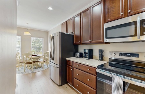 Rehoboth Beach House | Grande at Canal Pointe townhome with pools, sports courts, & gym