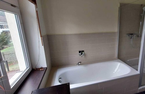 Friedrichroda Condo | Ground floor apartment with parquet, fireplace, terrace and garden