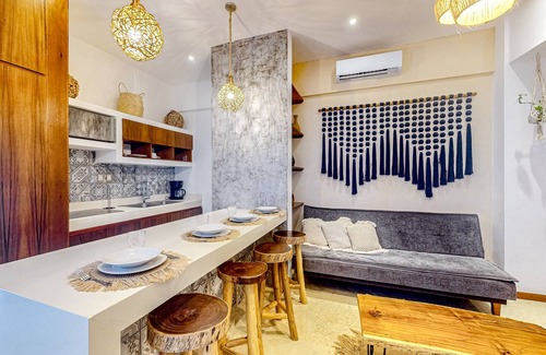 Zama Apartment | Ground-floor apt near downtown Tulum with rooftop pool, gym, soaking tub, & AC