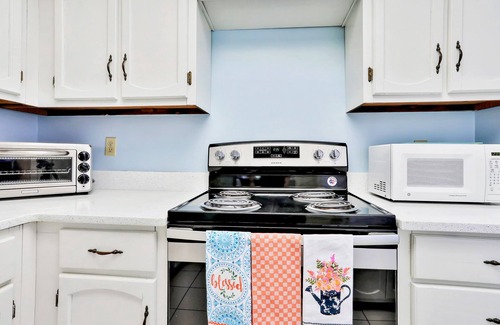 New Smyrna Beach Condo | Ground-floor condo in oceanfront complex with patio, AC, tennis, & pool