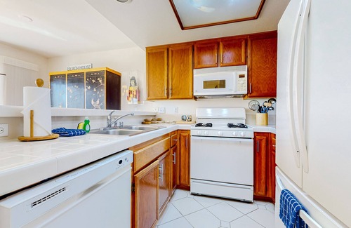 Townsite Condo | Ground-floor condo with ocean views, fireplace, on-site hot tubs & sauna