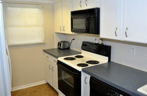 New Smyrna Beach Condo | Ground Floor! Keep your toys and fishing gear on the patio!