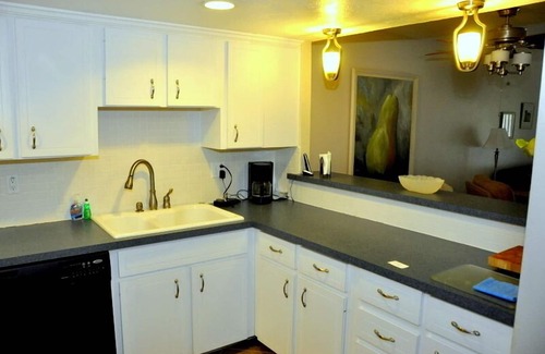 New Smyrna Beach Condo | Ground Floor! Keep your toys and fishing gear on the patio!