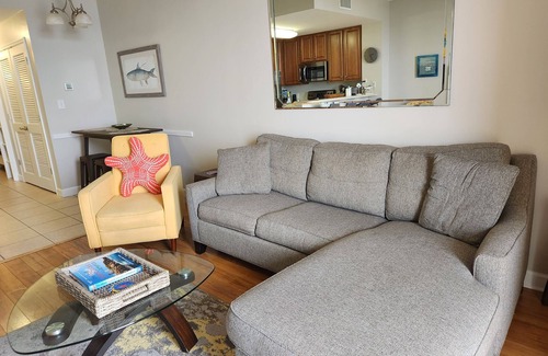 Lower Grand Lagoon Condo | GROUND FLOOR. OPENS UP TO POOL & BEACH. NO WAITING ON ELEVATOR.