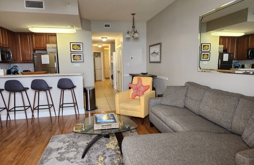 Lower Grand Lagoon Condo | GROUND FLOOR. OPENS UP TO POOL & BEACH. NO WAITING ON ELEVATOR.