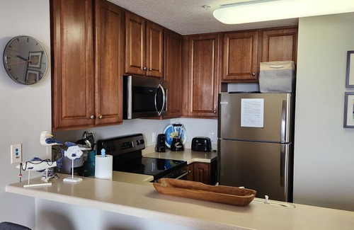 Lower Grand Lagoon Condo | GROUND FLOOR. OPENS UP TO POOL & BEACH. NO WAITING ON ELEVATOR.