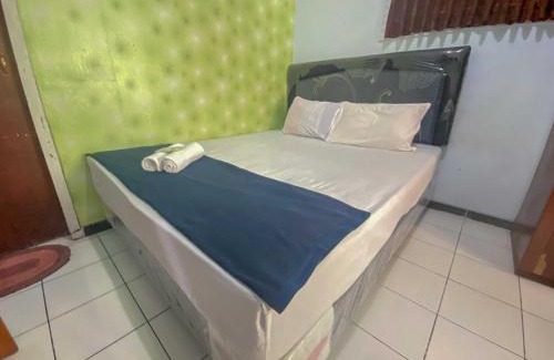 Slawi Hotel | Guest House Hj Muriyah Syariah Slawi Mitra RedDoorz