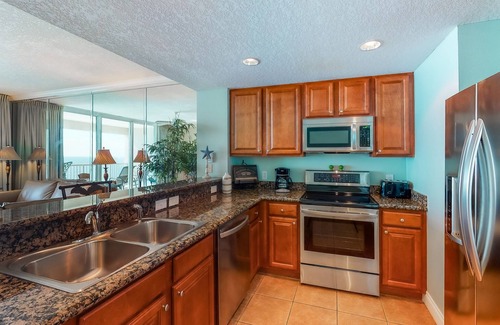 West Panama City Beach Condo | Gulf-facing condo with pool, scenic balcony, beach service & beach access