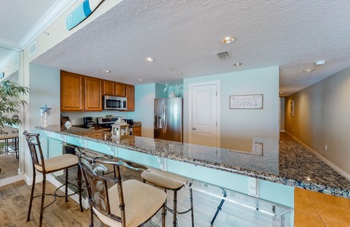 West Panama City Beach Condo | Gulf-facing condo with pool, scenic balcony, beach service & beach access