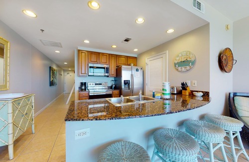 West Panama City Beach Condo | Gulf-front condo with beach access, pool, hot tub, lazy river, & beach chairs