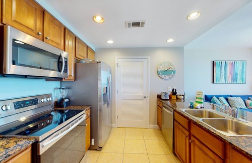 West Panama City Beach Condo | Gulf-front condo with beach access, pool, hot tub, lazy river, & beach chairs