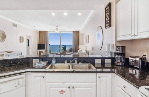 Panama City Beach Condo | Gulf front primary with king bed. Pools, hot tub, arcade and more!