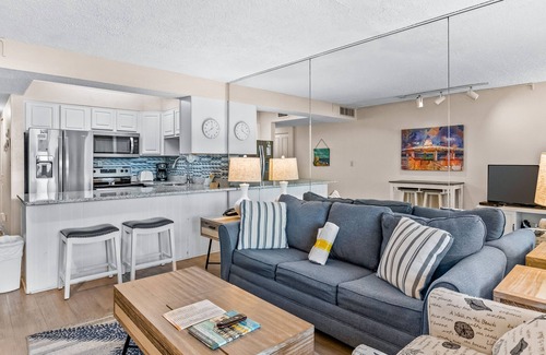 Holiday Isle Condo | Gulf-view condo with beach pavilion, balcony, heated pool, hot tub, gym, tennis