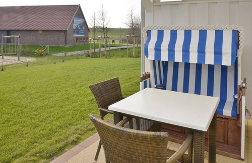 Wremen Apartment | Hübsche, Strandnahe Ferienwohnung mit Eigener Sauna und Terrasse mit Strandkorb
