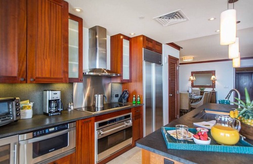 Ko Olina Condo | Hale Pumehana O-1202 stunning views and comfort
